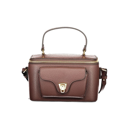 Handbag by Coccinelle for women in leather brown & signature features an refined silhouette, showcasing a secure zipper, ample external-pockets, and versatile shoulder-strap, handle & adjustable-strap for a sophisticated refined aesthetic.