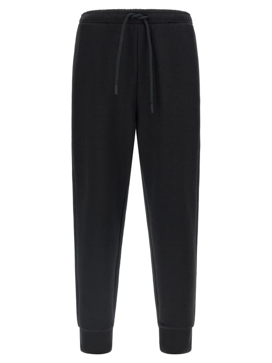Joggers by Hugo Boss for men in stretch cotton black presents a refined pantology silhouette, artfully defined by a refined pantology , long, and a sophisticated .