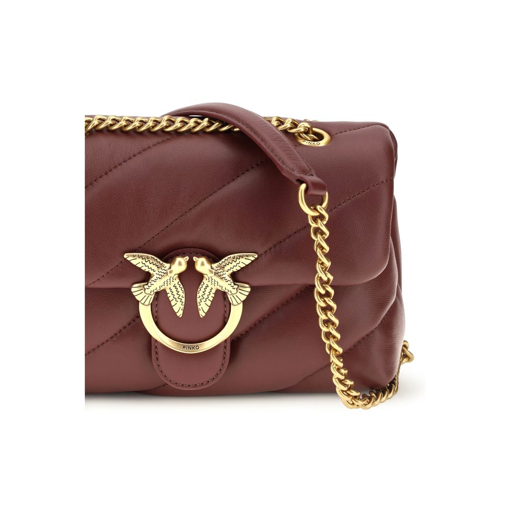 Mini 2-in-1 Shoulder & Crossbody Quilted Bag by PINKO for women in bos taurus calf leather bordeaux, gold & monogram features an effortlessly chic silhouette with a secure magnetic & button, ample , and versatile crossbody-strap & shoulder-strap for effortlessly chic everyday luxury.