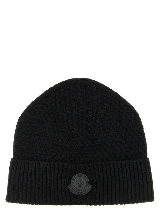 Beanie Hat by Moncler for men in cashmere wool & leather black features a distinguished knit construction, showcasing the sophisticated silhouette and distinguished finish of the Cashmere Wool & Leather Beanie Hat.