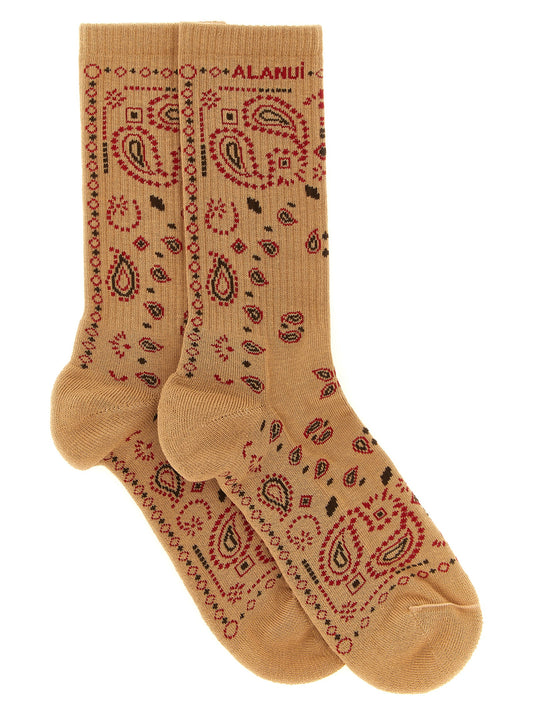 Socks by Alanui for women in stretch polyamide cotton beige, black, camel, red, patterned, paisley, jacquard & signature features an utilitarian chic finish from the Women's Stretch Polyamide Cotton Socks collection, offering an utilitarian chic fit that ensures sophisticated comfort.