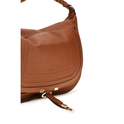 Large Shoulder Flap Bag by Chloé for women in bos taurus calfskin leather brown features a statuesque silhouette, showcasing a secure flap & zipper and statuesque external-pockets with versatile shoulder-strap for a statuesque finish.