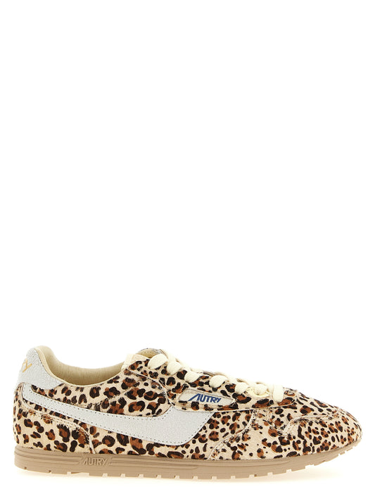 Sneakers by Autry for women in bos taurus cowhide leather gold, multicolor & print presents a sumptuous silhouette, artfully capturing the essence of the Pony Women's Low Top Bos Taurus Cowhide Leather Sneakers with its sumptuous low-top style design.