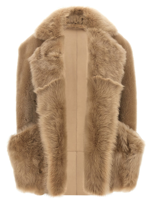 Vest by BLANCHA for women in lamb shearling beige & hazelnut features a enviable silhouette, elegantly detailed with a enviable and functional pockets for a enviable finish.