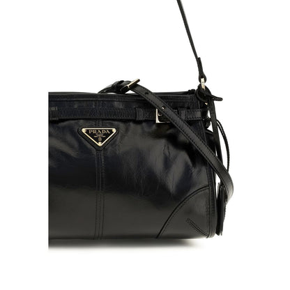 Small Shoulder Hobo Handbag by Prada for women in bos taurus calf leather black features an refined silhouette, showcasing a secure zipper, ample , and versatile shoulder-strap, handle, adjustable-strap, detachable-strap & belt-strap for a sophisticated refined aesthetic.