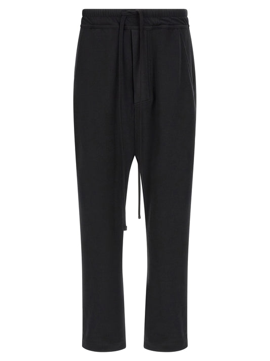 Trousers by Thom Krom for men in organic cotton black features an on trend silhouette, showcasing a sophisticated tapered-leg & relaxed-fit with a long and for an on trend finish.
