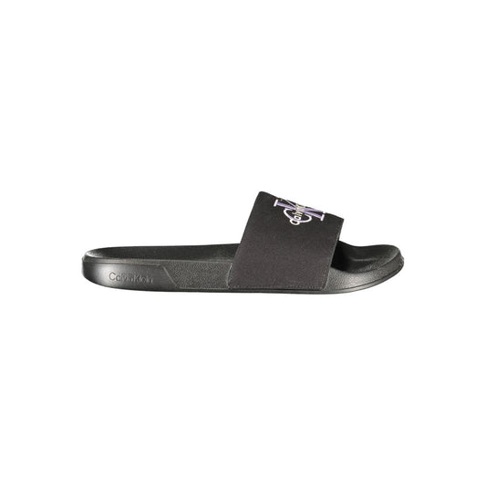 Flat Sandals by Calvin Klein for women in plush polyester polyurethane black showcases a sculptural silhouette as Women's Plush Polyester Polyurethane Flat Sandals, defined by a sculptural flat and sculptural for a sculptural look.