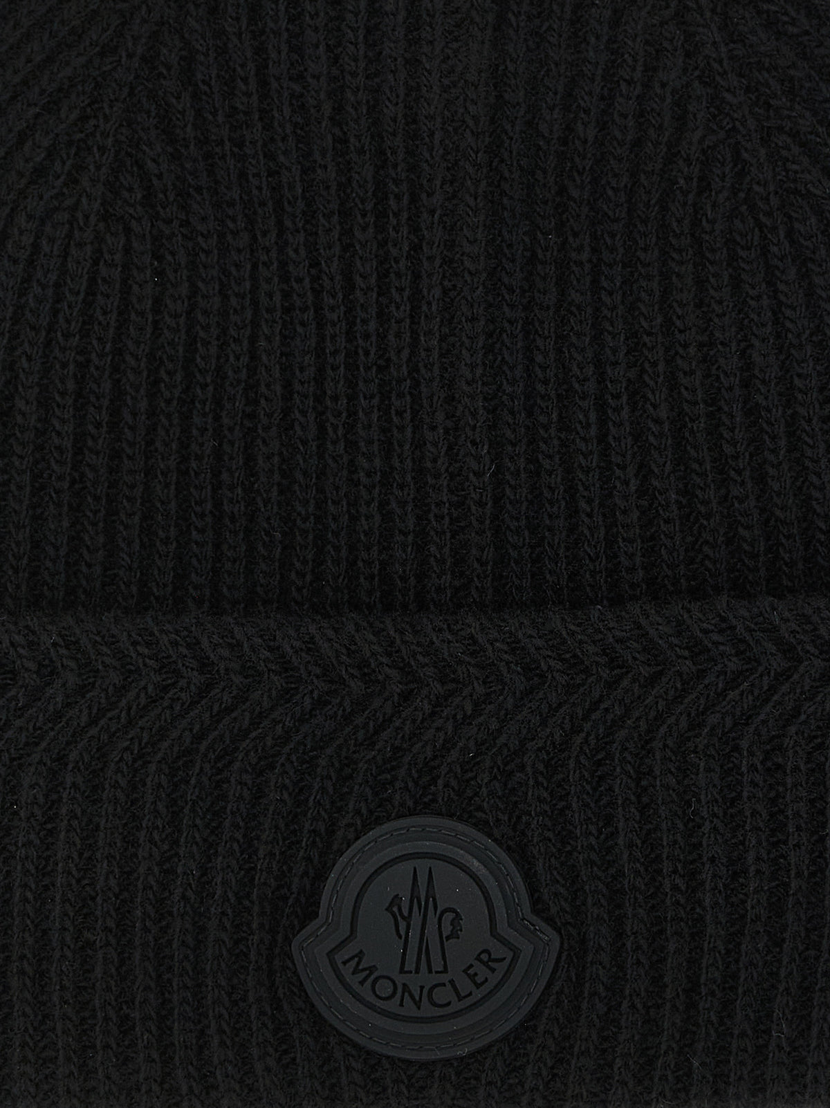 Beanie Hat by Moncler for men in cashmere virgin wool black, patterned & herringbone presents a sleek silhouette, showcasing the sleek texture and refined craftsmanship of the Cashmere Virgin Wool Beanie Hat collection.