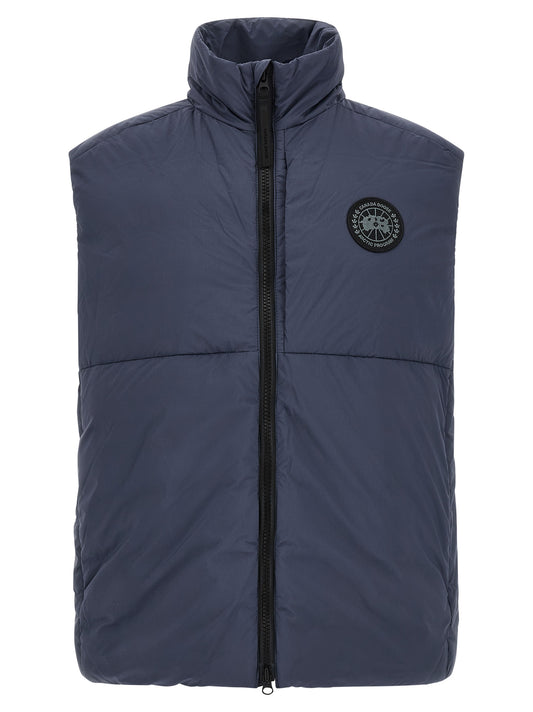 Vest by Canada Goose for men in polyamide black & dark-blue showcases a dynamic silhouette, perfectly balancing with a dynamic high-neck neckline for a sophisticated, high-fashion look.