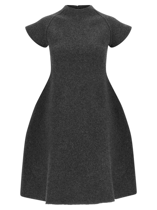 Dress by Jil Sander for women in virgin wool gray features a dramatic silhouette, showcasing an elegant mock neckline and that flows into a dramatic midi short.