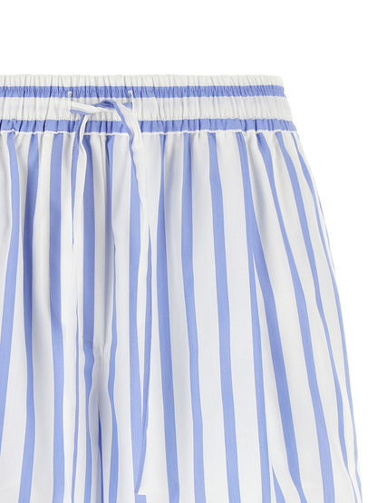 Bermuda Shorts by Dolce & Gabbana for women in cotton & silk light-blue, white, signature & striped presents a sleek silhouette, featuring a sleek relaxed-fit with a refined short and a sophisticated .