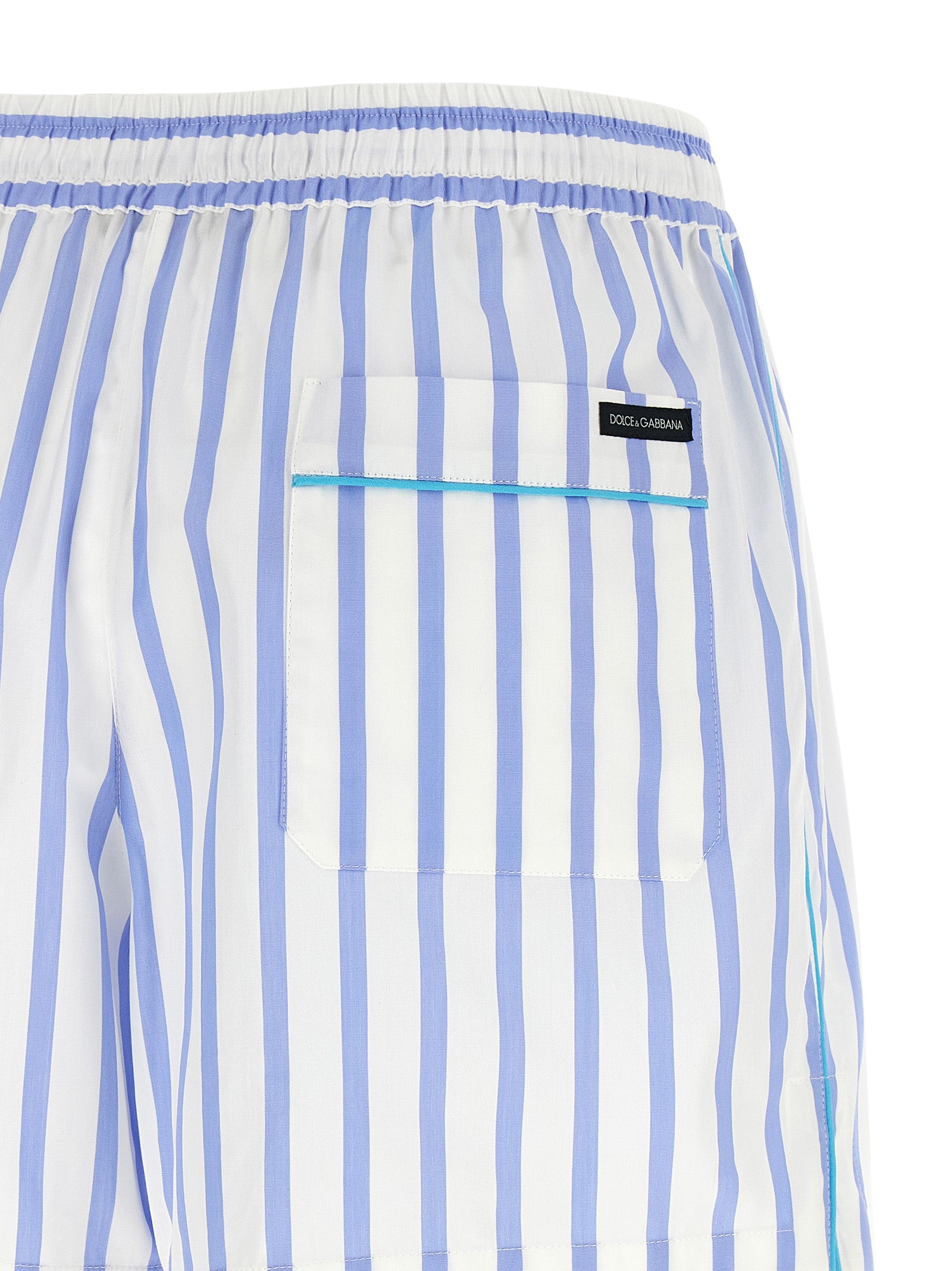 Bermuda Shorts by Dolce & Gabbana for women in cotton & silk light-blue, white, signature & striped presents a contemporary silhouette, showcasing a contemporary relaxed-fit with a refined short and elegant .