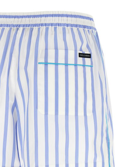 Bermuda Shorts by Dolce & Gabbana for women in cotton & silk light-blue, white, signature & striped presents a contemporary silhouette, showcasing a contemporary relaxed-fit with a refined short and elegant .