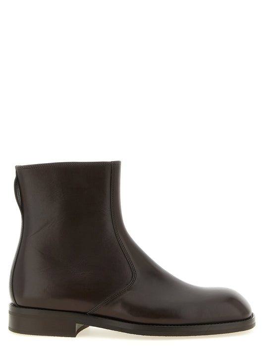 Low-Heel Ankle Boots by Lemaire for men in lamb leather brown features an high-performance silhouette, showcasing the sophisticated design of the Men's Lamb Leather Low-Heel Ankle Boots with a low-heel and a refined square toe style.