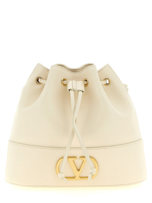 Medium Crossbody Bucket Handbag by Valentino Garavani for women in lamb leather gold, white & signature features a transformative elegance silhouette, showcasing a secure drawstring & toggle, organized , and versatile crossbody-strap & shoulder-strap for a transformative elegance look.