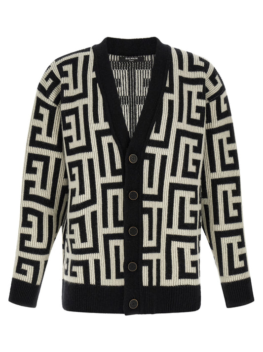 Cardigan by Balmain for men in cashmere merino wool & goat leather bicolour, black, white & monogram showcases a captivating silhouette, artfully detailed with a captivating and v-neck neckline for a truly sophisticated captivating look.
