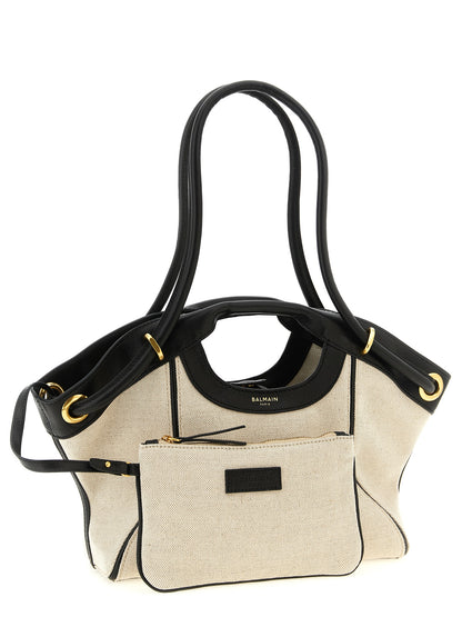 Shopper Tote Clutch Bag by Balmain for women in linen cotton & leather bicolour, black, gold & white features an sumptuous Linen Cotton & Leather Shopper Tote Clutch Bag design with a secure snap, ample , and versatile handle & adjustable-strap for an sumptuous finish.