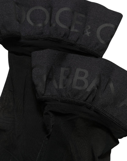 These Socks by Dolce & Gabbana for women in stretch nylon & calf leather black present a utilitarian silhouette from the Women's Stretch Nylon & Calf Leather Socks collection, offering a utilitarian fit and refined aesthetic.