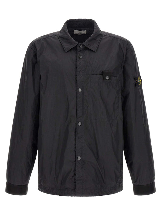 Windbreaker Jacket by Stone Island for men in nylon & resin black & signature presents a resilient silhouette, artfully detailed with a sophisticated shirt-collar neckline and functional lightweight & windproof for a resilient finish.