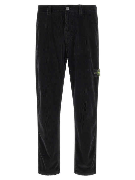 Trousers by Stone Island for men in organic cotton corduroy black presents a perennial silhouette, meticulously tailored with a cut, long finish, and an elegant .