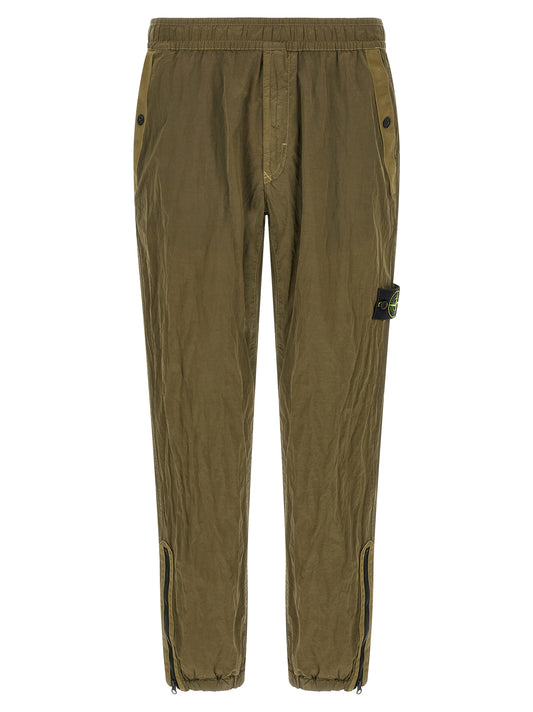 Joggers by Stone Island for men in nylon bicolour, green & olive features an refined tailoring silhouette, showcasing a premium athletic with a and long cut for a refined tailoring look.