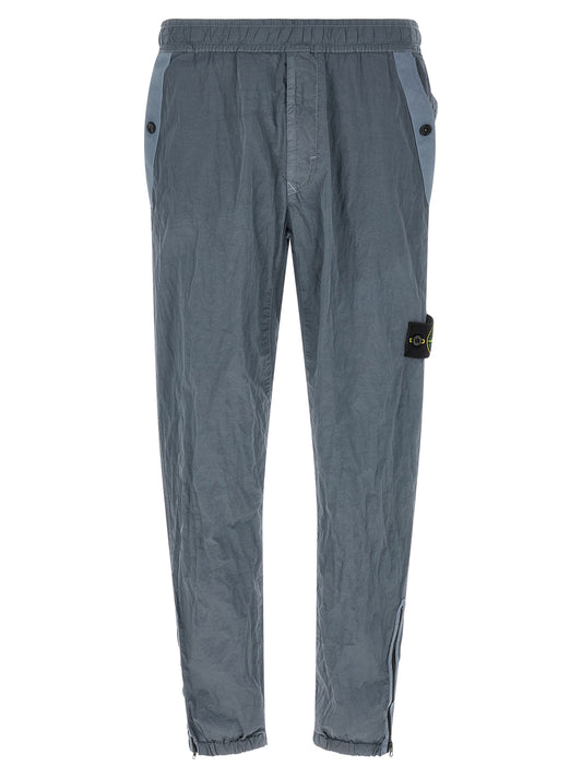 Joggers by Stone Island for men in nylon gray features an sartorial and long with a cut for a sartorial finish.
