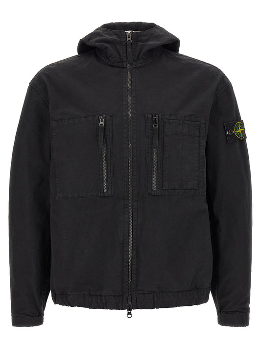 Hooded Windbreaker Jacket by Stone Island for men in cotton black features an perennial silhouette with a refined hooded neckline and perennial pockets, hooded & windproof for a sophisticated weather-resistant look.