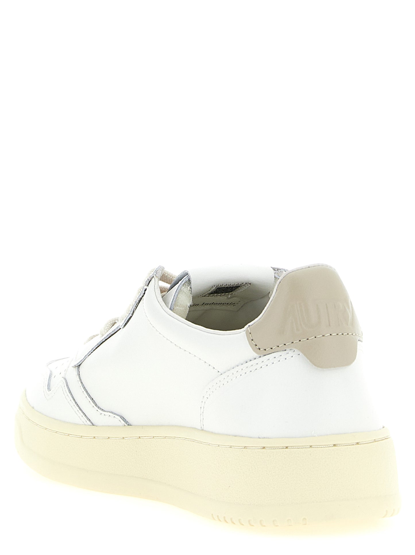 Sneakers by Autry for men in bos taurus cowhide leather beige presents a impeccable silhouette as Men's Low Top Tennis Bos Taurus Cowhide Leather Sneakers, expertly defined by a impeccable low-top tennis style for a impeccable, high-fashion look.