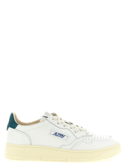 Sneakers by Autry for men in bos taurus cowhide leather bicolour, green & teal presents a impeccable silhouette as Men's Low Top Bos Taurus Cowhide Leather Sneakers, expertly defined by a impeccable low-top style for a impeccable, high-fashion look.
