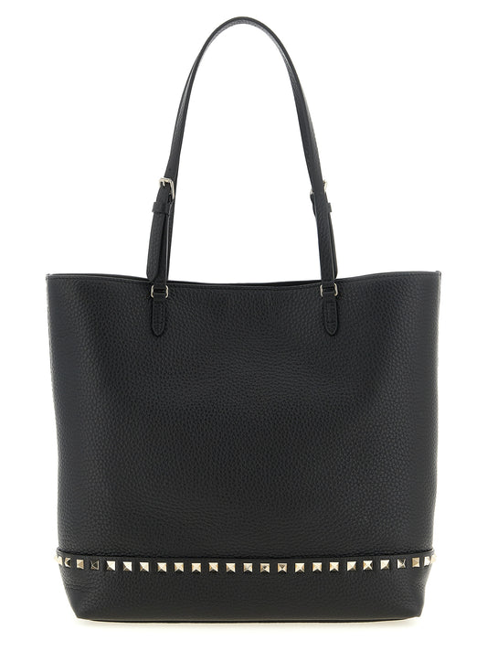 Medium Shoulder Tote Bag by Valentino Garavani for women in suede calfskin leather black & print features a effortless chic silhouette with a secure zipper & magnetic, ample , and versatile shoulder-strap, handle & adjustable-strap for a effortless chic finish.