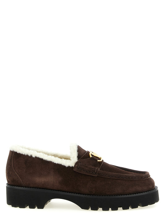 Flat Loafer Slip-On Shoes by Valentino Garavani for women in suede calfskin leather brown, gold & signature showcases a timeless silhouette from the V Logo Women's Suede Calfskin Leather Flat Loafer Slip-On Shoes collection, featuring a timeless flat and for a timeless finish.