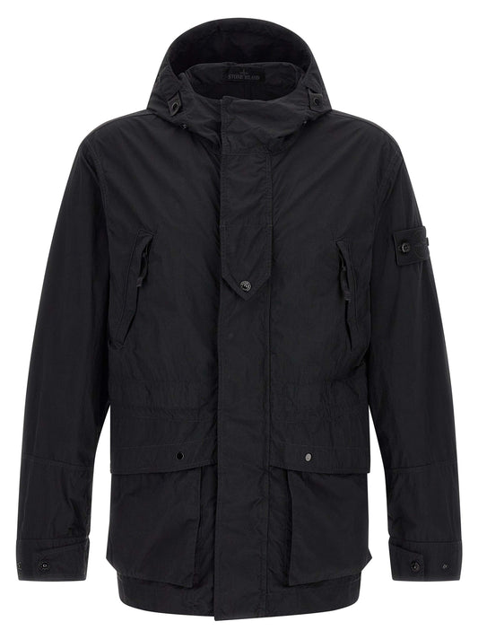 Windbreaker Jacket by Stone Island for men in polyamide black features an enduring silhouette, showcasing technical pockets, hooded & windproof and a sophisticated hooded high-collar neckline for a truly enduring aesthetic.