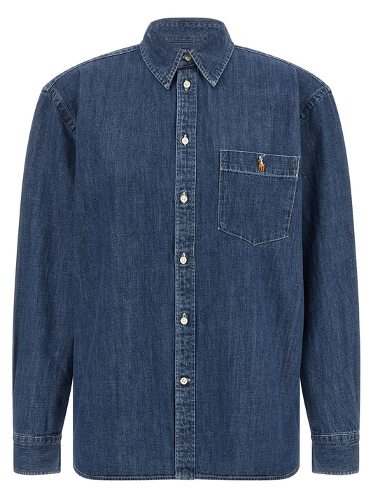 Blouse by Polo Ralph Lauren for women in denim cotton blue showcases a sublime silhouette, artfully detailed with a sublime and for a sophisticated, sublime finish.