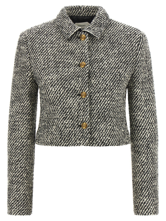 Overcoat by Versace for women in virgin wool & nylon bicolour, black, gold, white & patterned features a contemporary silhouette showcasing a contemporary and refined for a sophisticated finish.