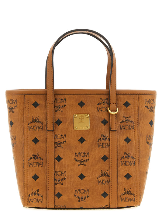 Small Shopper Tote Bag by MCM for women in polyester polyethylene polyurethane leather brown, gold, signature & monogram features an utilitarian-chic silhouette, showcasing the Visetos Polyester Polyethylene Polyurethane Leather Small Shopper Tote Bag design with a secure zipper, ample , and versatile shoulder-strap, handle & adjustable-strap.