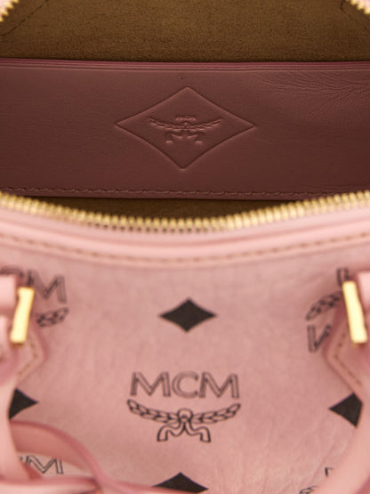 This Travel Belt Pouch Handbag by MCM for women in nappa polyester polyethylene polyurethane leather and gold, multicolor, pink & monogram presents a sculptural silhouette featuring a secure zipper, ample , and versatile shoulder-strap for a sculptural finish.