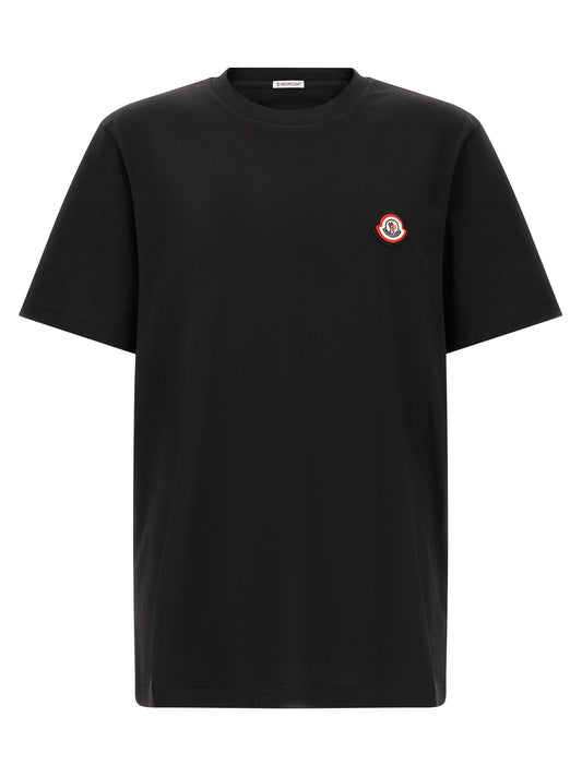 T-Shirt by Moncler for men in cotton black showcases a chic silhouette, artfully detailed with a chic crew neckline and short-sleeve for a chic finish.