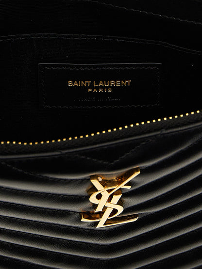 Clutch Handbag by Saint Laurent for women in calfskin leather black features a architectural silhouette, showcasing a secure zipper, ample , and versatile wristlet & handle for a architectural finish.