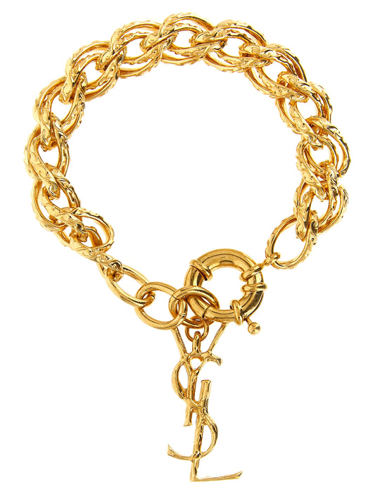Bracelet by Saint Laurent for women in cashmere cotton & silk gold showcases a cosmopolitan silhouette, artfully capturing the essence of the cosmopolitan Cassandre Women's Chain Charm Woven Gold Brass Bracelet with a cosmopolitan chain charm woven bracelet design.