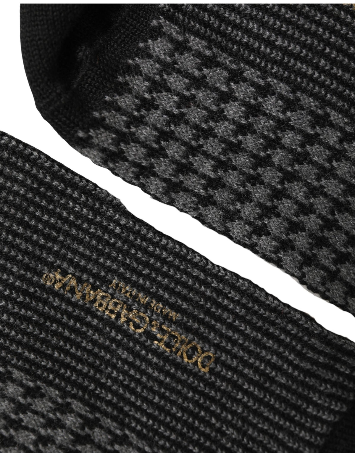Socks by Dolce & Gabbana for men in calf leather nylon acrylic wool black, gray, patterned, houndstooth & signature features a snug silhouette, artfully capturing the essence of the snug Men's Calf Leather Nylon Acrylic Wool Socks design for a sophisticated look.