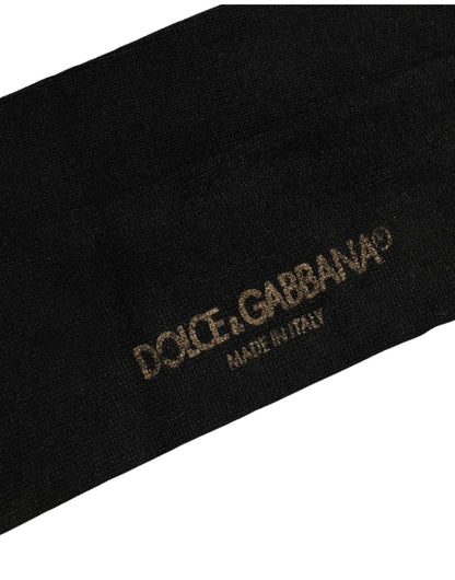 Socks by Dolce & Gabbana for men in nylon & viscose black features a snug silhouette, artfully capturing the essence of the snug Men's Nylon & Viscose Socks design for a sophisticated look.