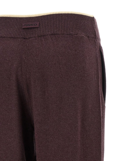 Trousers by PINKO for women in cashmere purple features an on trend silhouette, showcasing a sophisticated relaxed-fit, wide & slim with a long and for an on trend finish.