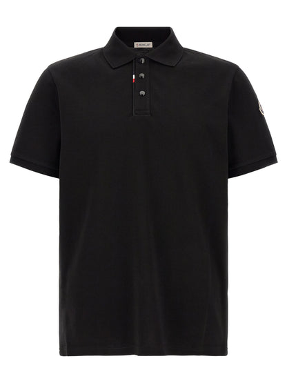 Polo Shirt by Moncler for men in cotton felt black presents a distinguished silhouette, showcasing a sophisticated and distinguished short-sleeve for a truly distinguished finish.