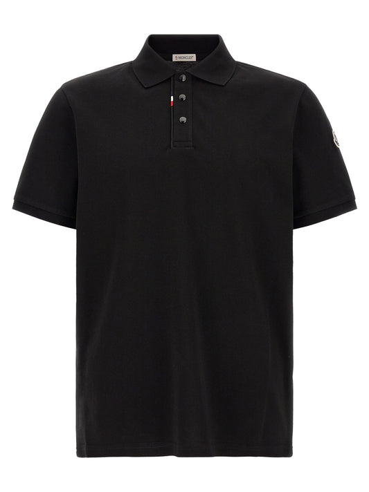 Polo Shirt by Moncler for men in cotton felt black presents a distinguished silhouette, showcasing a sophisticated and distinguished short-sleeve for a truly distinguished finish.