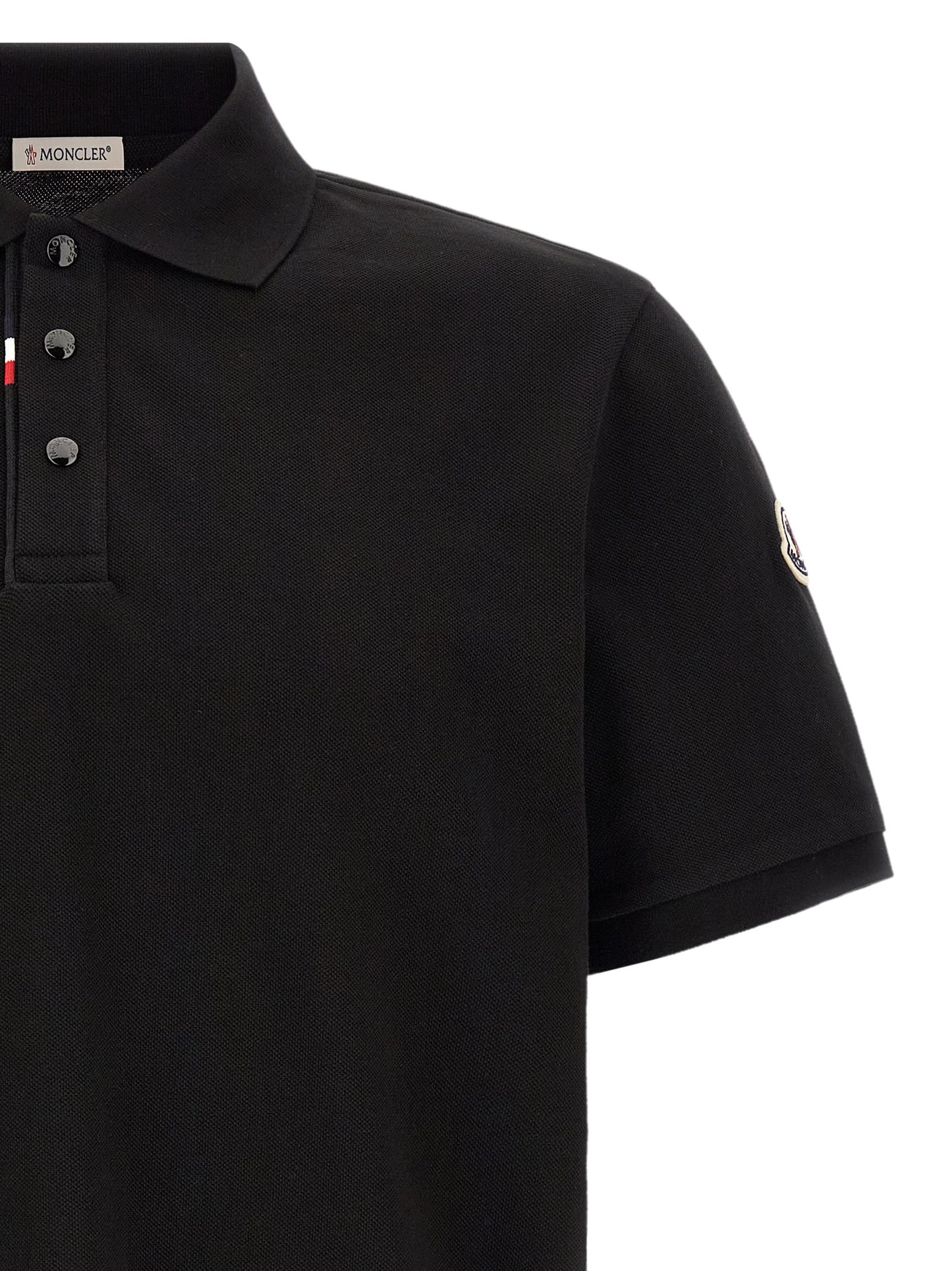 This Polo Shirt by Moncler for men in cotton felt black presents a flawless silhouette, showcasing flawless detailing and a refined for a truly flawless aesthetic.