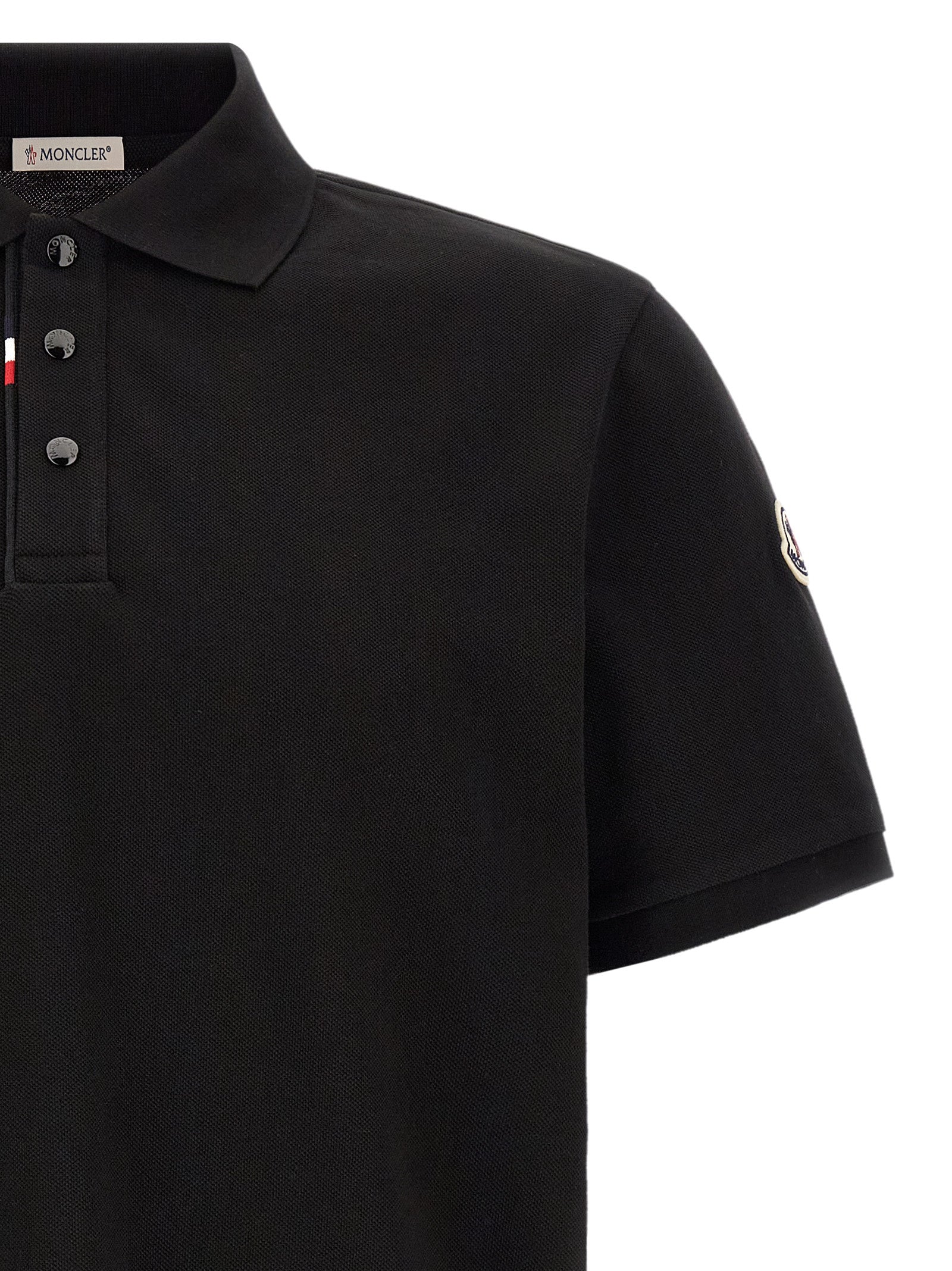 This Polo Shirt by Moncler for men in cotton felt black presents a flawless silhouette, showcasing flawless detailing and a refined for a truly flawless aesthetic.
