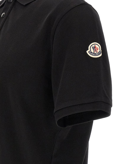 Polo Shirt by Moncler for men in cotton felt black presents a crisp silhouette, artfully detailed with a crisp and crisp .