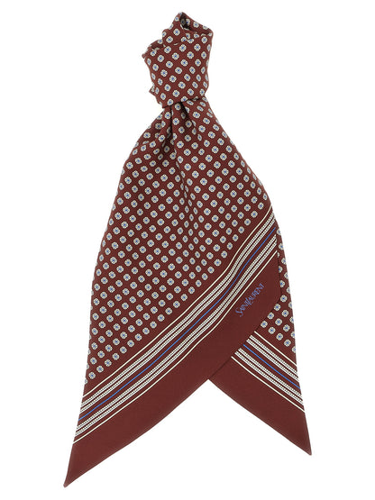 Scarf by Saint Laurent for men in silk twill blue, bordeaux, burgundy, white, patterned, signature & striped showcases a warm silhouette from the Silk Twill Foulard Scarf collection, offering a warm drape that exudes sophisticated luxury.