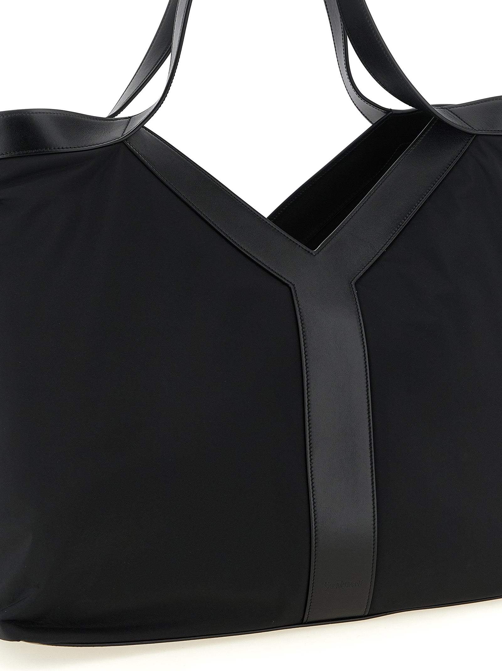 Large Tote Bag by Saint Laurent for men in bos taurus calfskin leather & polyamide black features an metropolitan chic City Bos Taurus Calfskin Leather & Polyamide Large Tote Bag design with a secure , metropolitan chic , and versatile handle for a metropolitan chic look.