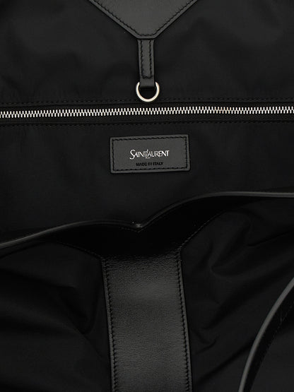 Large Tote Bag by Saint Laurent for men in bos taurus calfskin leather & polyamide black features a distinguished City Bos Taurus Calfskin Leather & Polyamide Large Tote Bag design, complete with a secure , ample , and versatile handle for a distinguished look.